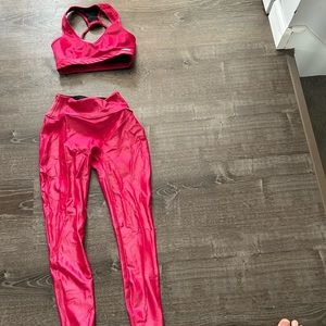 Gently used bombshell sportswear gloss leggings and matching bra set in red.